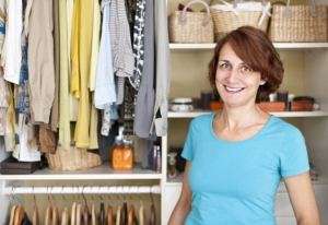 Professional Organizer standing in front of organized closet